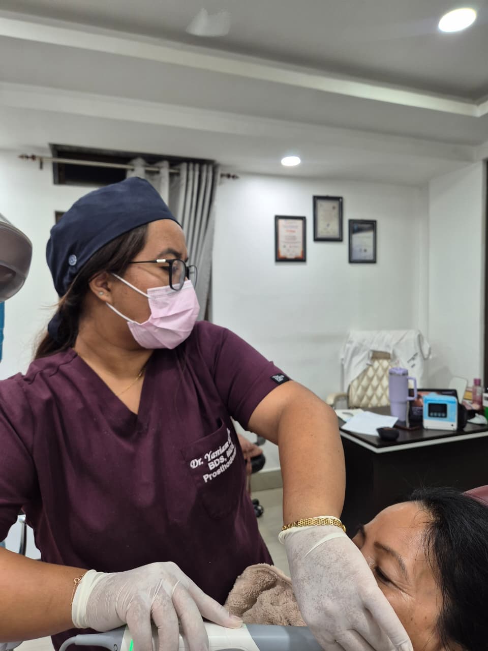 Dr. Yaniam examining a patient